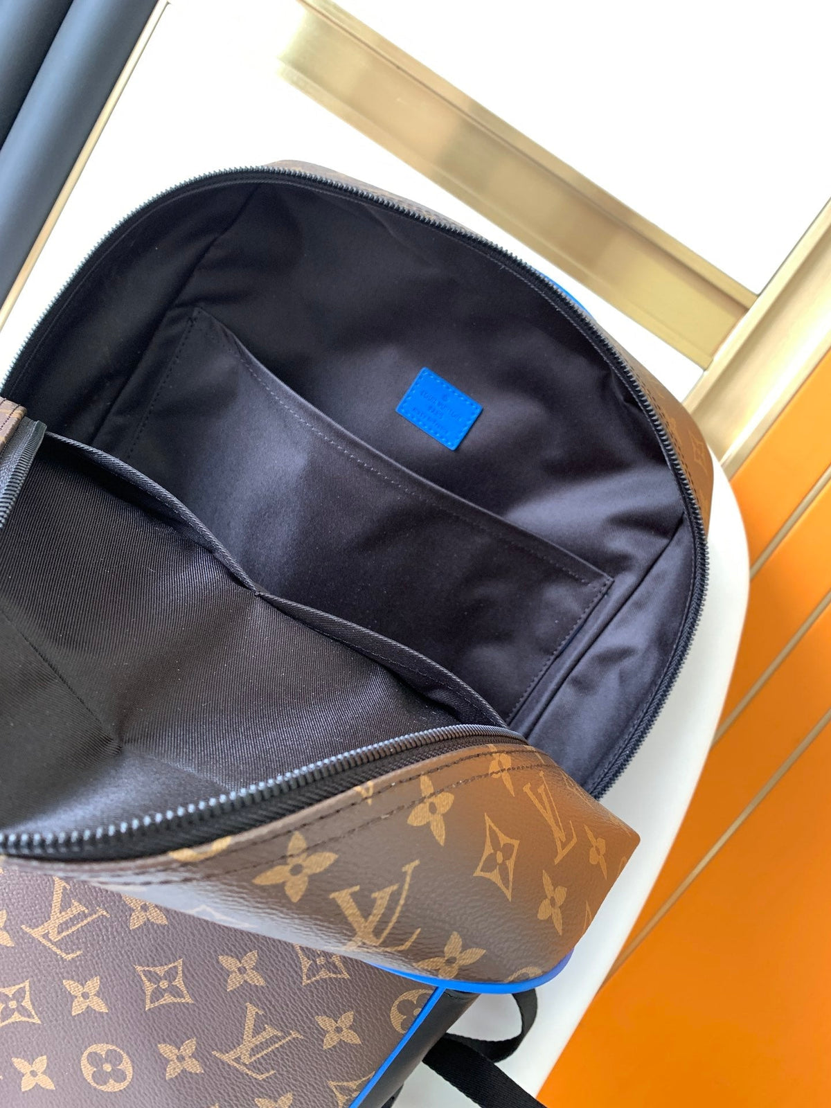 DEAN BACKPACK 42 IN BLUE AND BROWN MONOGRAM CANVAS