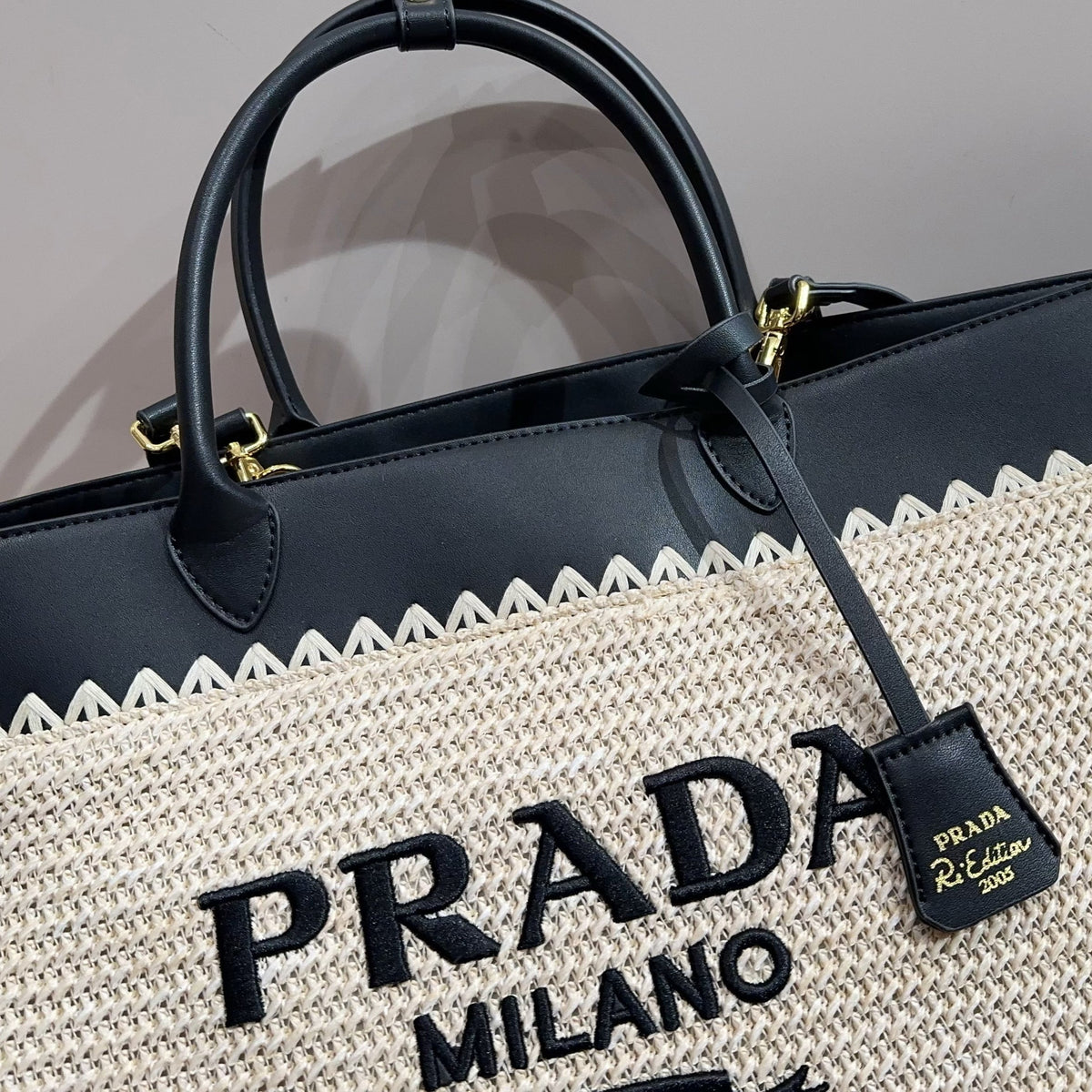 CROCHET TOTE BAG 32 IN BEIGE WOVEN RAFFIA WITH BLACK CALFSKIN STRAP