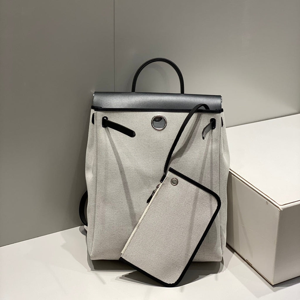 HERBAG A DOS ZIP RETOURNE BACKPACK 29 IN OFF-WHITE CANVAS AND BLACK CALFSKIN