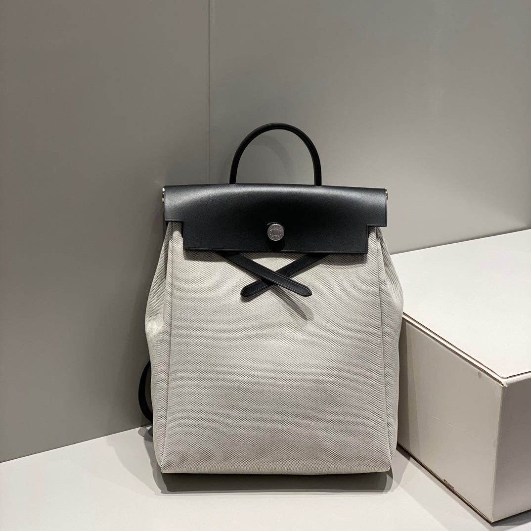 HERBAG A DOS ZIP RETOURNE BACKPACK 29 IN OFF-WHITE CANVAS AND BLACK CALFSKIN
