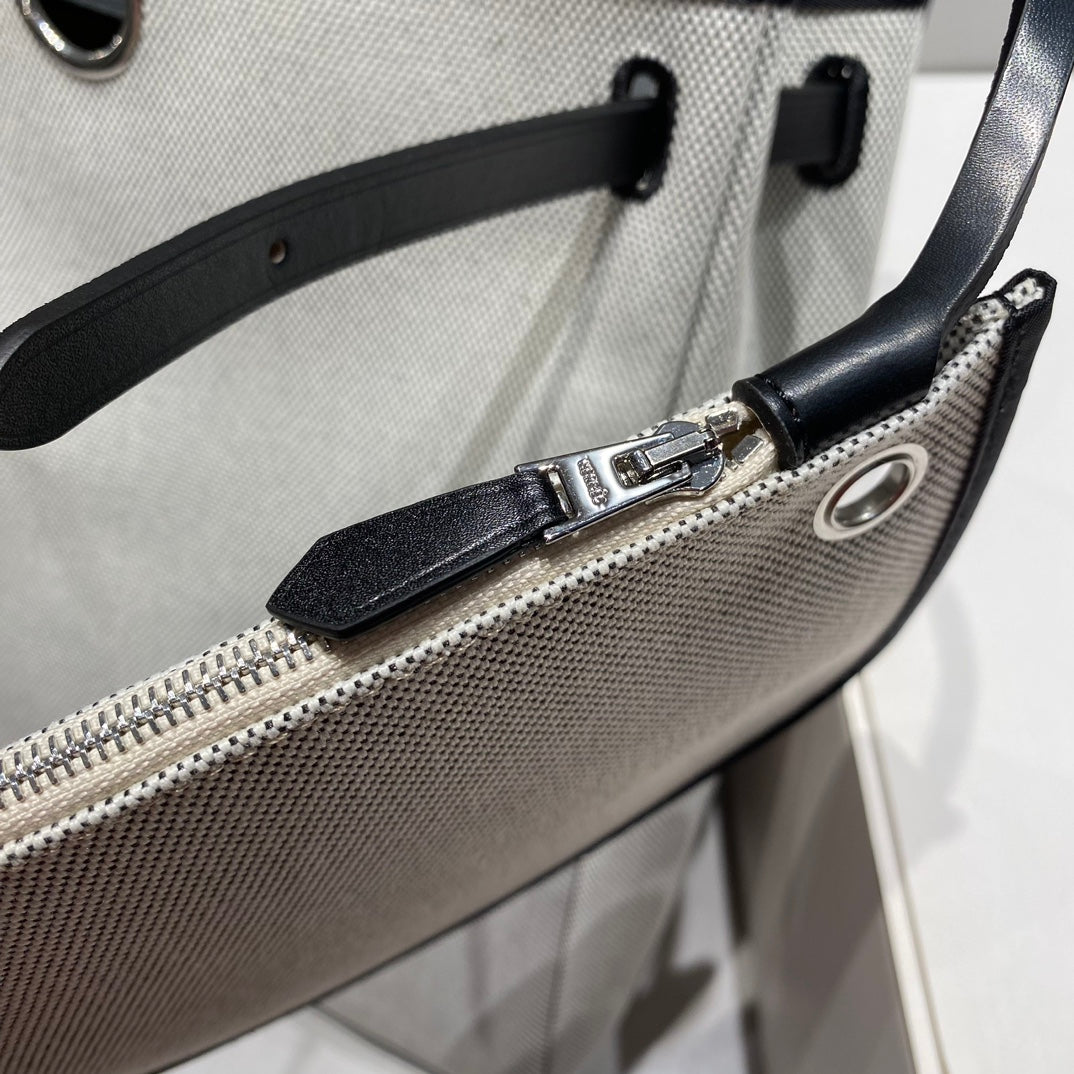 HERBAG A DOS ZIP RETOURNE BACKPACK 29 IN OFF-WHITE CANVAS AND BLACK CALFSKIN