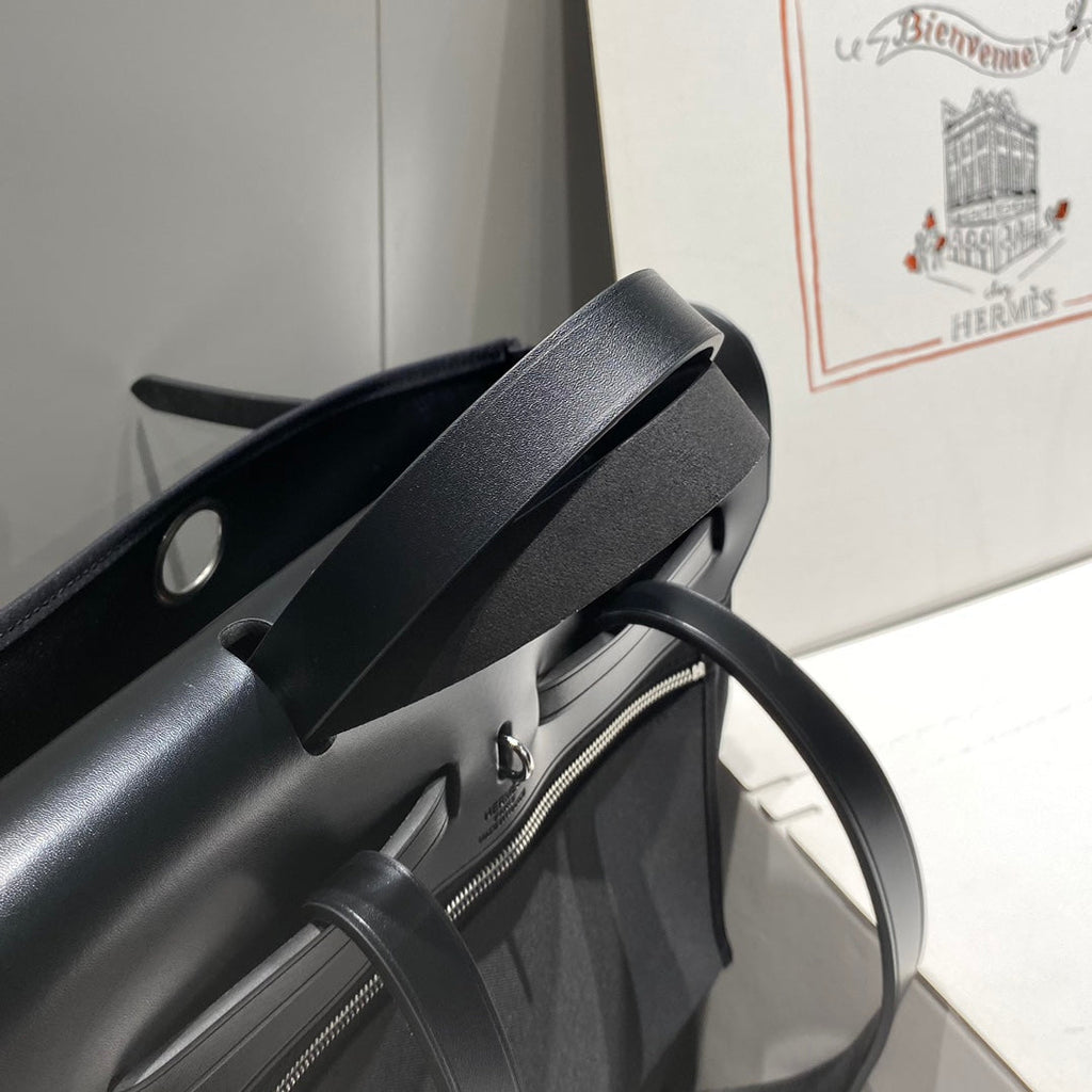 HERBAG A DOS ZIP RETOURNE BACKPACK 29 IN BLACK CANVAS AND CALFSKIN