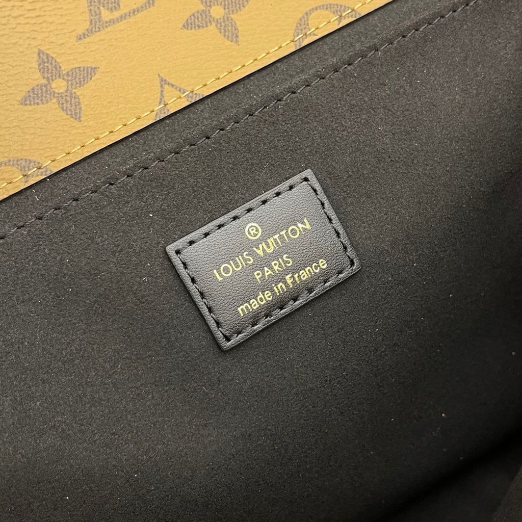 pochette metis 25 monogram reverse canvas